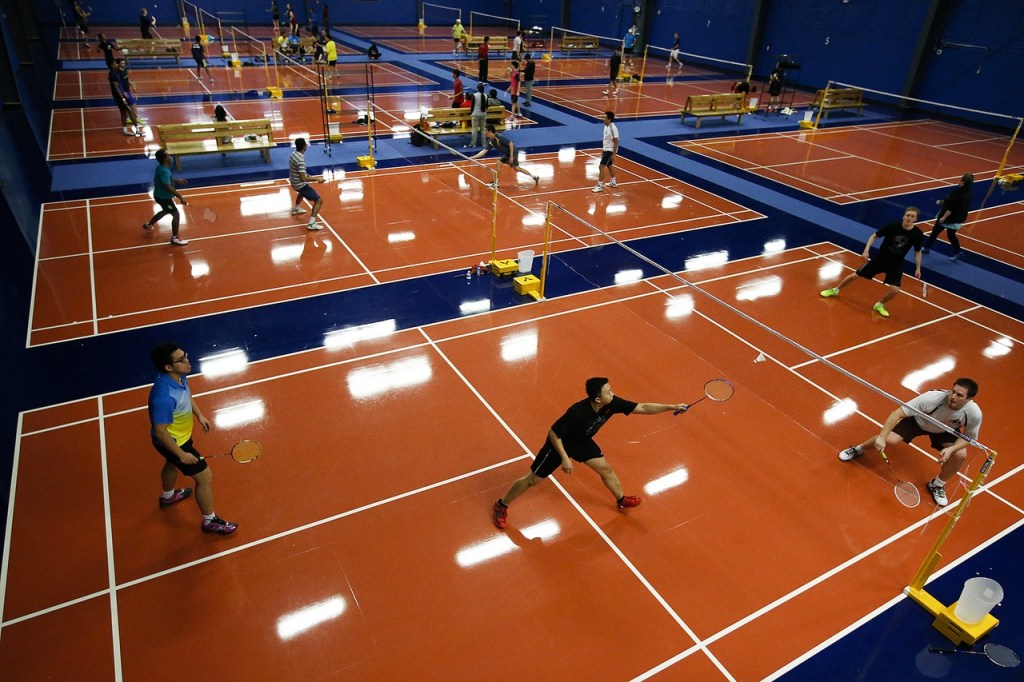 Players compete in a doubles tournament held across twelve courts at the newly opened Harbour Pointe Badminton Club in Mukilteo during a tournament on Saturday, Jan. 21. (Ian Terry / The Herald)