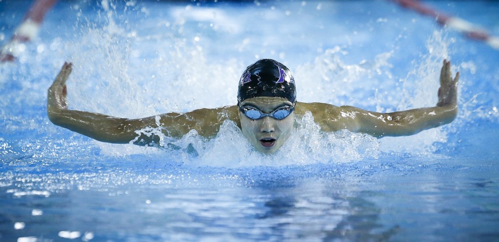 Kamiak&rsquo;s Maxwell Fang glides to victory in the 100-yard butterfly race during a meet against Jackson on Tuesday at West Coast Aquatics in Mill Creek. (Ian Terry / The Herald)