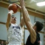 Kamiak&rsquo;s Patrick Olson (left) goea up for a shot during a game against Monroe at Kamiak High School on Friday. (Ian Terry / The Herald)