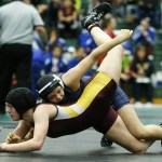Glacier Peak&rsquo;s Kiley Hubby (top) takes down Lakewood&rsquo;s Bethany Fisher on her way to winning a semifinal bout in the 140-pound weight class at the Lady Wolfpack Invite in Mill Creek on Saturday. Hubby won the tournament and Fisher tied for fifth. (Ian Terry / The Herald)