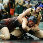 Everett&rsquo;s Rachel Christiansen (right) tries to control Yelm&rsquo;s Aly Glasper during a bout in the 125-pound weight class during the Lady Wolfpack Invite in Mill Creek on Saturday. (Ian Terry / The Herald)
