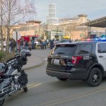 The victim of a stabbing in the food court at the Alderwood mall in Lynnwood is loaded into a Lynnwood Fire Department aid unit Sunday. The victim, a man in his 20s, was taken to Harborview Medical Center in Seattle. (Photograph by Michael O&rsquo;Leary)