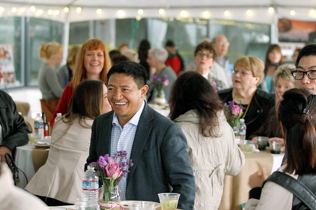 Developer Lobsang Dargey (center) attends a sneak peak event at Potala Place Everett on April 30, 2015. (Ian Terry / Herald file)