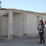 Tamara Alcala Dominguez walks with her grandmother, Petra Bello Suarez, in their hometown of Molcaxac, Puebla, Mexico, during Alcala&rsquo;s first return home since she left Mexico for the U.S. as a toddler. (AP Photo/Pablo Spencer)