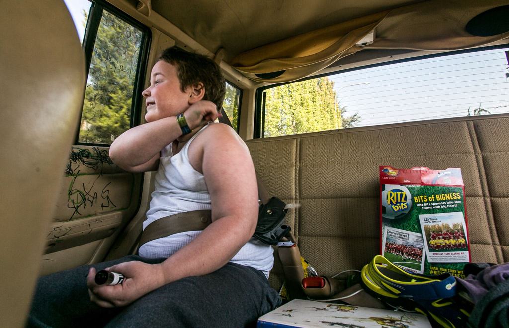 Jessie Pyles rides is his customary seat on the way home from the dentist&rsquo;s office. The family tries not let Jessie ride in any other vehicles due the damage he causes and his ever-present black marker. (Kevin Clark / The Herald)