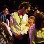 Young Life Leader Josh Tremain smiles at Faith Fitch, who performed during the Snohomish County Capernaum&rsquo;s Got Talent Variety Show hosted by Young Life on December 5, 2015. The evening showcased the talents of young people living with disabilities as they performed onstage in the Public Utility District building.