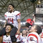 Anfernee Gurley atop Jackson Yost shoulders leads the rally after Archbishop Murphy wins the 2A Gridiron Classic at the Tacoma Dome on December 3, 2016. Archbishop Murphy defeated Liberty 56-14 for the state championship. (Kevin Clark / The Herald)