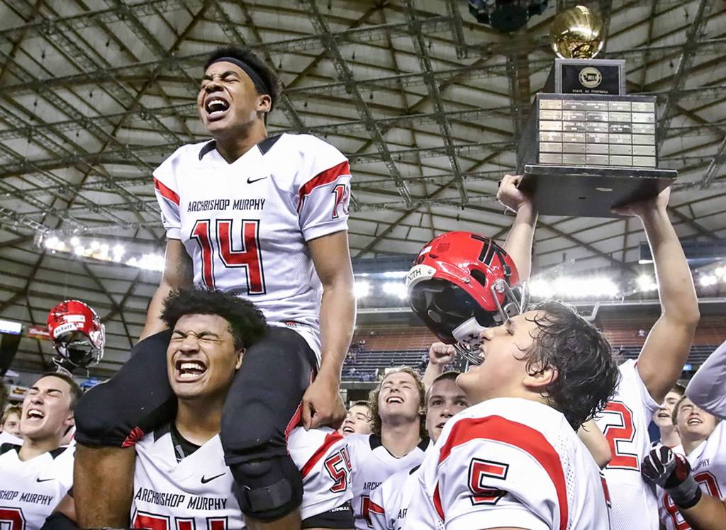 Anfernee Gurley atop Jackson Yost shoulders leads the rally after Archbishop Murphy wins the 2A Gridiron Classic at the Tacoma Dome on December 3, 2016. Archbishop Murphy defeated Liberty 56-14 for the state championship. (Kevin Clark / The Herald)