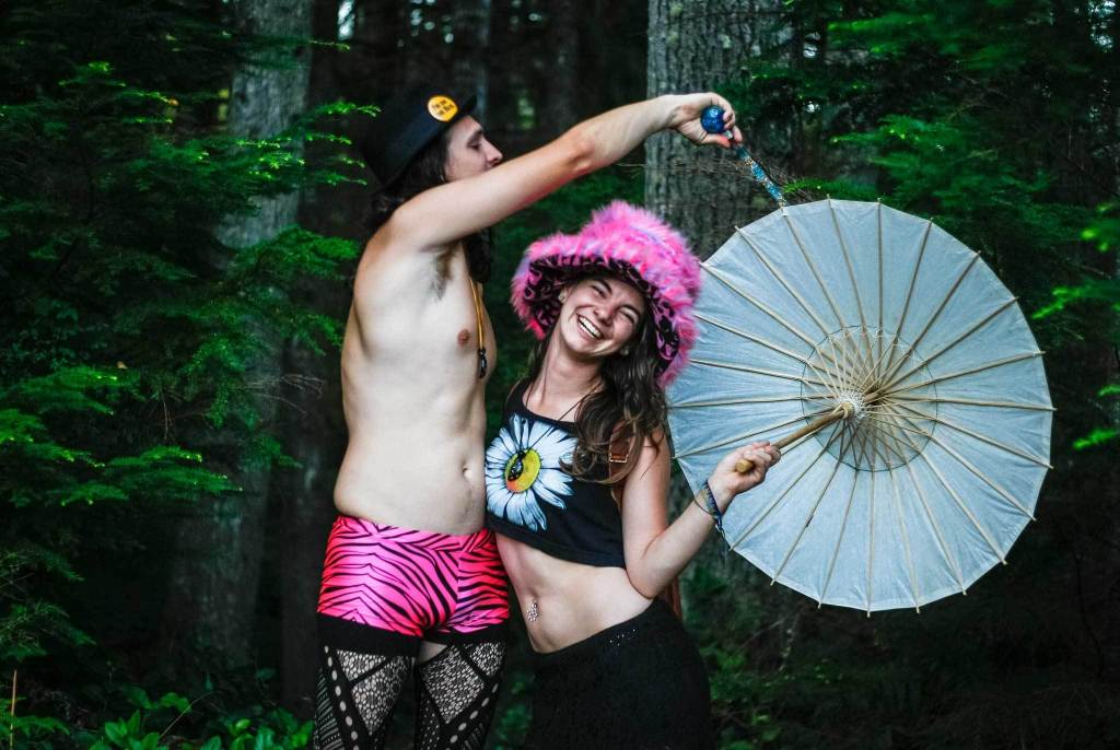 Mike Richardson and his girlfriend Celeah Norris pose for a portrait during day one of Summer Meltdown on Aug. 11, 2016, in Darrington. The annual music festival runs four days with live music, art installations, workshops and on-site camping for attendants. (Daniella Beccaria / For The Herald)