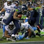 Seahawks running back Thomas Rawls (34) rushes for a touchdown against the Lions in the second half of a NFC playoff game on Saturday in Seattle. (AP Photo/Elaine Thompson)