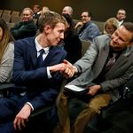 Stanwood planning commissioner Nate Nehring (left) is congratulated by Marysville Councilman Michael Stevens after the Snohomish County Council announced that Nehring was picked to fill a vacant council seat on Monday. (Dan Bates / The Herald)