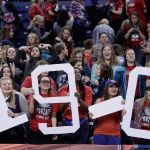 Gonzaga fans in the student section hold a &ldquo;19-0&rdquo; sign, signifying their team&rsquo;s record after Gonzaga beat Portland on Saturday in Spokane. (AP Photo/Young Kwak)