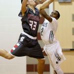 Stanwood&rsquo;s Nate Kummer (left) steals a pass intended for Edmonds-Woodway&rsquo;s Jalen Nash (right) during a boys game Tuesday at Edmonds-Woodway High School in Edmonds. Stanwood won 85-66. (Andy Bronson / The Herald)