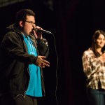 Keith Lasher raps while his girlfriend, Regan Harris, sings during the &ldquo;We Day&rdquo; celebration and birthday party at Marysville Pilchuck High School on Saturday. Lasher&rsquo;s former teacher, Jim Strickland, inspired him to turn his birthday into a community event and fundraiser to build a school in Kenya. (Daniella Beccaria / The Herald)