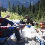 Rich Steward (left), of Mukilteo, chats with Pacific Crest Trail thru hikers near to where the famous trail crosses Highway 20 in the North Cascades National Park on Thursday, Sept 15. Folks who set up free checkpoints with food and supplies are called &ldquo;Trail Angels&rdquo; by hikers of the Pacific Crest Trail. (Ian Terry / The Herald)