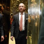 Amazon founder and CEO Jeff Bezos gets on an elevator for a meeting between President-elect Donald Trump and technology industry leaders at Trump Tower in New York on Dec. 14, 2016. (AP Photo/Evan Vucci)