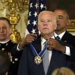 President Barack Obama presents Vice President Joe Biden with the Presidential Medal of Freedom during a ceremony in the State Dining Room of the White House in Washington on Thursday, Jan. 12. (AP Photo/Susan Walsh)