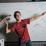 Timothy John, 25, an aerospace engineering senior at UCLA who hopes to go into the defense industry, poses at the Design Build Fly&rsquo;s club lab in Los Angeles on Jan. 4. (Marcus Yam/Los Angeles Times)