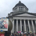 Protesters mark Inauguration Day on the steps of the state Capitol in Olympia on Friday. (AP Photo/Rachel La Corte)