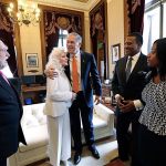 Washington Gov. Jay Inslee, center, embraces singer Judy Collins as they meet before his inaugural address to a joint session of the Legislature, Wednesday, Jan. 11, 2017, in Olympia, Wash. Looking on are Collins&rsquo; husband, Louis Nelson, left, Rev. Leslie Braxton and Braxton&rsquo;s daughter, Karissa Braxton. Collins sang the national anthem and Braxton provided the invocation. (AP Photo/Elaine Thompson)