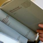 A clerk holds &ldquo;Hitler, Mein Kampf – A Critical Edition&rdquo; in a bookstore in Munich, Germany. (AP Photo/Matthias Schrader, file)