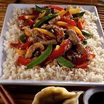 Bill Hogan / Chicago Tribune                                Pork, peppers, mushroom and pea pods make an easy stir-fry that&rsquo;s even better with wine.