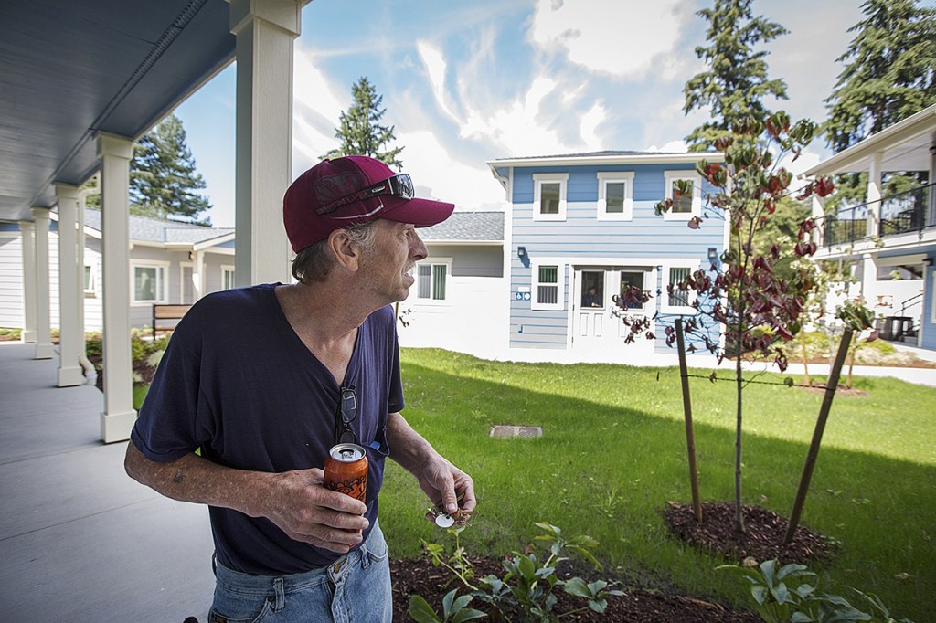 Ricky Kyles takes a walk around Sebastian Place, the new facility for chronically homeless veterans in Snohomish County, on Aug. 8, 2016, in Everett. (Daniella Beccaria / Herald file)