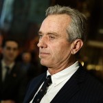 Robert F. Kennedy Jr. talks with reporters in the lobby of Trump Tower in New York on Tuesday, Jan. 10, after meeting with President-elect Donald Trump. (AP Photo/Evan Vucci)