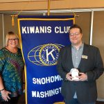 Outgoing president Debbie Emge awards the Kiwanis Club of Snohomish&rsquo;s 2016 Member of the Year award to Jared Burns. (Contributed photo)