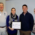 John Van Dalen (left) and Sgt. 1st Class Jamie Hawley (right) of the Washington Employer Support of the Guard and Reserve Committee present Eisenhower Middle School Principal Stefani Koetje with a Patriot Award Jan. 10. Koetje was nominated by counselor and Army National Guard Maj. Morgan Wolff (center right). (Contributed photo)