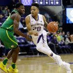 Washington&rsquo;s Markelle Fultz (20) tries to drive past Oregon&rsquo;s Dylan Ennis in the first half of a game Wednesday in Seattle. (AP Photo/Elaine Thompson)