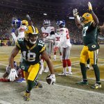 Packers wide receiver Randall Cobb (18) celebrates after making a touchdown reception during the first half of an NFC wild-card playoff game against the Giants on Sunday in Green Bay, Wis. (AP Photo/Mike Roemer)