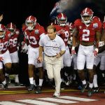 Head coach Nick Saban and the Alabama team enter the field before the first half of the Peach Bowl playoff game against Washington on Dec. 31 in Atlanta. (AP Photo/John Bazemore)