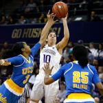Washington guard Kelsey Plum (10) goes up for a shot while being guarded by UCLA in the second half of a game on Sunday in Seattle. Washington won 82-70. (Logan Riely/The Seattle Times via AP)