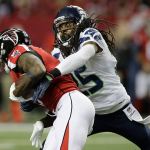 Seahawks cornerback Richard Sherman (25) tackles Falcons wide receiver Julio Jones (11) during the first half of an NFC divisional playoff game this past Saturday in Atlanta. (AP Photo/David Goldman)
