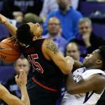 Washington forward Noah Dickerson (right) knocks the ball loose as he fouls Utah guard Lorenzo Bonam in the first half of a game Saturday in Seattle. (AP Photo/Ted S. Warren)