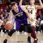 Washington forward Sam Timmins (33) drives to the basket against Arizona State guard Kodi Justice (44) during the first half of a game Jan. 25 in Tempe, Ariz. (AP Photo/Matt York)
