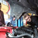 Inmer Villeda (left) and Nick Berni look over an engine for course work Thursday afternoon at Meadowdale High School in Lynnwood. (Kevin Clark / The Herald)