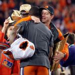 Clemson head coach Dabo Swinney hugs quarterback Deshaun Watson after the Tigers defeated Alabama 35-31 Monday night in the national championship game. (AP Photo/John Bazemore)