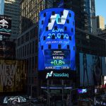 In this photo, the display at Nasdaq Tower in New York&rsquo;s Times Square shows that the Dow Jones industrial average closed above the 20,000-point mark for the first time Wednesday, Jan. 25. (Rohini Shahriar/Nasdaq via AP)