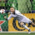 Seattle Sounders goalkeeper Stefan Frei makes a stop against FC Dallas in the second half of an MLS playoff match in October in Seattle. (AP Photo/Ted S. Warren, File)