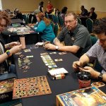 Courtesy OrcaCon                                Ella Lindquist, Jay Deiman and Cory Osborn play a game of Dale of Merchants at OrcaCon 2016.