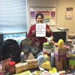 Raj Hariharan with donations for homeless students at Lowell Elementary School, one of three schools to receive donations from her efforts. (Contributed photo)