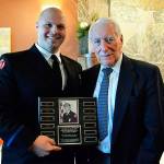 Arlington firefighter and paramedic Steve Daggett (left) is congratulated by Dr. Werner Samson on receiving Harborview Medical Center Paramedic Training Program&rsquo;s Chief Jack N. Richards Most Inspirational Paramedic Student Award. (Contributed photo)