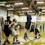 Erwin Weary of Cedar Park Christian attempts a shot over Rainier Christian&rsquo;s Logan Hanbey Thursday night at Cedar Park Christian School in Mountlake Terrace on December 29, 2016. (Kevin Clark / The Herald)
