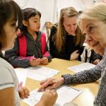 Allison Chilipe (left) gets help from Terry Andersen on schoolwork at Trinity Lutheran Church in Lynnwood on Jan. 7. (Kevin Clark / The Herald)