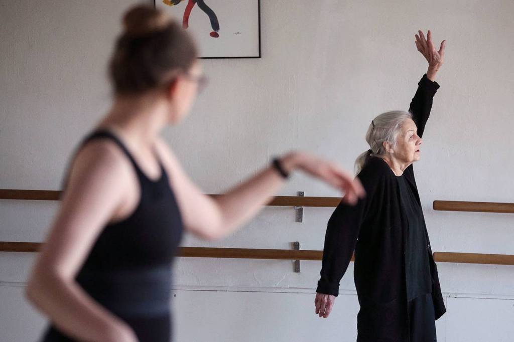 Lida Smith, 86, works with modern dance student Kaitlyn Bostrom, 18, earlier this month at The Dance School in Everett.                                &nbsp;(Kevin Clark / The Herald)&nbsp;