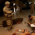 A U.S. Army Central soldier competing in the Top Medic Competition waits to be graded during a tactical combat casualty care lane Dec. 17 at Camp Buehring, Kuwait. The tiring, stressful 36-hour competition, hosted by 3rd Armored Brigade Combat Team, 1st Armored Division, tested the soldiers&rsquo; basic warrior skills, medical skills proficiency, and overall physical strength and endurance. (U.S. Army photo by Sgt. Jonathan Fernandez)