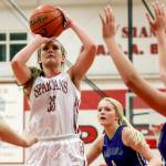 Stanwood&rsquo;s Ashley Alter attempts a shot with Edmonds-Woodway&rsquo;s Bailee Chynoweth trailing Wednesday night in Stanwood. The Spartans won 67-36. (Kevin Clark / The Herald)