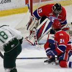 Everett&rsquo;s Brandson Hein fires a goal past Spokane goalie Dawson Weatherill with Spokane&rsquo;s Ty Smith (24) looking on during the Silvertips&rsquo; 5-0 win over the Chiefs on Wednesday night at Xfinity Arena in Everett. (Kevin Clark / The Herald)